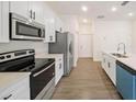 Modern kitchen with stainless steel appliances, ample counter space, and bright lighting at 1686 Sw 168Th Loop, Ocala, FL 34473