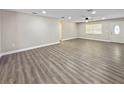 Bright living room featuring sleek floors, neutral walls, ceiling fan, and natural light at 5 Bahia Circle Pl, Ocala, FL 34472