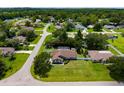 A beautiful home with a screened-in pool and lush landscaping, nestled in a peaceful residential neighborhood at 5390 Se 15Th Ct, Ocala, FL 34480