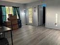 Bright living room with updated flooring and natural light, offering a comfortable and inviting atmosphere at 8134 Fairways Cir # R203, Ocala, FL 34472