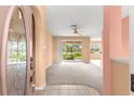 View of the home's entrance, with lots of sunlight coming in from the glass patio doors in the living room at 8380 Sw 82Nd Cir, Ocala, FL 34481