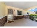 Inviting covered front porch with decorative details and a welcoming entrance door with a window at 8704 Sw 94Th Ln # G, Ocala, FL 34481