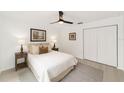 Comfortable bedroom with soft lighting, neutral color scheme, ceiling fan, and ample closet space at 1083 Sw Winding Hills Rd, Dunnellon, FL 34431