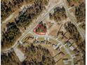 Aerial view of property within red outline in forested neighborhood with surrounding single-Gathering homes at 13322 Sw 85 Cir, Ocala, FL 34473