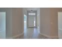 Bright foyer with a transom window over the front door and tile flooring at 13585 Sw 51St Ln, Ocala, FL 34481