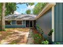 Close-up of charming blue home with mature landscaping at 1841 Ne 38Th St, Ocala, FL 34479