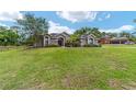 Beautiful home with a large front lawn, stone accents, and a welcoming entrance at 2151 Se 59Th St, Ocala, FL 34480
