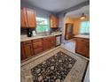 Well-appointed kitchen featuring wood cabinets, stainless steel appliances, and an adjacent dining area at 3709 Ne 4Th St, Ocala, FL 34470