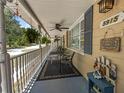 Cozy front porch with seating, decorative accents, and a welcoming ambiance at 5915 Se Holly Rd, Belleview, FL 34420
