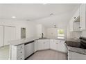 Well-appointed kitchen with granite countertops and white cabinets providing ample storage at 681 Sw Fig Tree Ln, Dunnellon, FL 34431