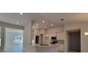 Bright kitchen featuring a peninsula island, modern appliances, and a seamless transition to the living area at 12384 Sw 96Th Ln, Dunnellon, FL 34432