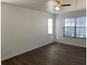 Bright bedroom with neutral walls, wood-look flooring, and two windows for ample natural light at 3381 Nw 44Th Ct, Ocala, FL 34482