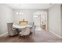 Formal dining room with elegant chandelier and stylish furniture at 5239 Sw 114Th Street Rd, Ocala, FL 34476