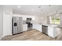 Well-equipped kitchen with stainless steel appliances, granite countertops, and modern cabinetry at 6560 Se 108Th Ln, Belleview, FL 34420