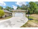 Detached garage with a basketball hoop, offering extra storage and recreational space for outdoor activities at 8605 Sw 209Th Court Rd, Dunnellon, FL 34431