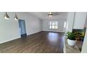 Bright, open living room with hardwood floors and plenty of natural light at 8771 Sw 115Th St, Ocala, FL 34481