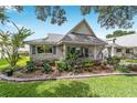 Charming single story home boasts a well-manicured lawn and a picturesque porch perfect for relaxing at 8841 Sw 91St St # A, Ocala, FL 34481