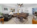 Cozy living room with plush seating, a ceiling fan, and hardwood floors at 8841 Sw 91St St # A, Ocala, FL 34481