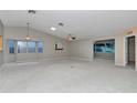 Bright and airy living room with neutral tones, large windows, and ample natural light at 9069 Sw 91St Cir, Ocala, FL 34481