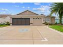 Charming home featuring a decorative driveway, a two-car garage, and well-maintained landscaping at 15549 Sw 11Th Terrace Rd, Ocala, FL 34473