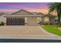 Stunning home exterior boasting a three-car garage and perfectly manicured lawn at 15549 Sw 11Th Terrace Rd, Ocala, FL 34473