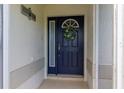 Welcoming front door with wreath and decorative sign, offering a warm entrance to the home at 1768 Sw 156Th Ln, Ocala, FL 34473