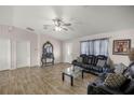 Inviting living room features wood-look tile flooring, sofas, and a stylish accent table at 28 Hemlock Radial Loop, Ocala, FL 34472