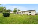 Spacious backyard featuring a fenced area and lush green grass, perfect for outdoor enjoyment at 10720 Sw 63Rd Ave, Ocala, FL 34476