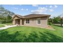 Attractive single-story home with a stone-accented facade and a well-manicured lawn at 10835 Se Highway 464C, Ocklawaha, FL 32179