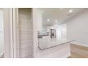 Modern kitchen featuring stainless steel appliances, granite countertops, a pantry, and ample storage space at 2264 Sw Moines Ct, Dunnellon, FL 34431