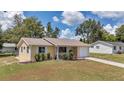 Charming single-story home with well-maintained lawn and inviting front porch at 8144 Sw 108Th Street Rd, Ocala, FL 34481
