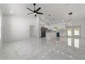 Bright, open-concept living area featuring a spacious layout, marble floors, and modern finishes at 13741 Sw 81St Cir, Ocala, FL 34473