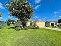 Charming single-story home with a well-manicured lawn and mature landscaping in a sunny setting at 15822 Sw 16Th Avenue Rd, Ocala, FL 34473
