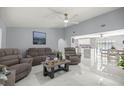 Bright living room featuring white marble floors, neutral paint, and an open floor plan at 2201 Ne 45Th St, Ocala, FL 34479