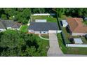 This aerial shot showcases the charming single-story home with a well-kept lawn and backyard at 26 Hemlock Terrace Dr, Ocala, FL 34472