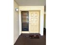 Welcoming front door entrance with security window and 'Welcome' mat at 3525 E Fort King St # 140, Ocala, FL 34470