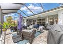 Expansive screened patio with stylish furniture and an open-air feel, perfect for outdoor entertaining at 4340 Nw 56Th Ct, Ocala, FL 34482