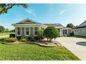 A well-manicured front yard with lush landscaping, showcasing the home's attractive curb appeal at 5093 Nw 35Th Lane Rd, Ocala, FL 34482