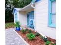 Charming home with colorful trim, beautiful landscaping, and a welcoming front entrance at 626 Ne 21St St, Ocala, FL 34470