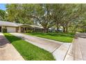 Street view of homes with mature trees providing shade at 8850 Sw 97Th St # C, Ocala, FL 34481