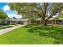 Lovely home boasts a lush, green lawn and a charming front porch at 8850 Sw 97Th St # C, Ocala, FL 34481