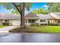 Inviting single-story home featuring a covered porch, attached garage, and manicured landscaping at 9367 Sw 83Rd Ave # C, Ocala, FL 34481