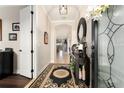 Tastefully decorated foyer with stylish console table, area rug, and views into the home at 9634 Sw 67Th St, Ocala, FL 34481
