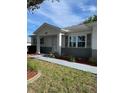 Well-maintained single-story home with charming front entrance and landscaped front yard at 9711 Sw 97Th Pl, Ocala, FL 34481