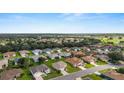 Aerial view of a residential community with lush landscaping and nearby amenities at 13100 Se 93Rd Terrace Rd, Summerfield, FL 34491