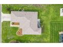 Overhead view of the house showcasing the roof, landscaping, and surrounding greenery at 13100 Se 93Rd Terrace Rd, Summerfield, FL 34491