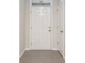 Bright entryway with tile flooring and a view of an interior door at 2984 Ne 43Rd Rd, Ocala, FL 34470