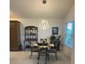 Cozy dining area featuring stylish lighting and a window for natural light at 530 Casteel Ave, The Villages, FL 32163