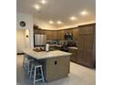 Beautiful kitchen with a large center island, seating, stainless steel appliances, and ample cabinet space at 530 Casteel Ave, The Villages, FL 32163