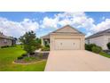 Beautiful home with a two car garage, mature landscaping, and a well-maintained driveway at 7765 Sw 86Th Loop, Ocala, FL 34476